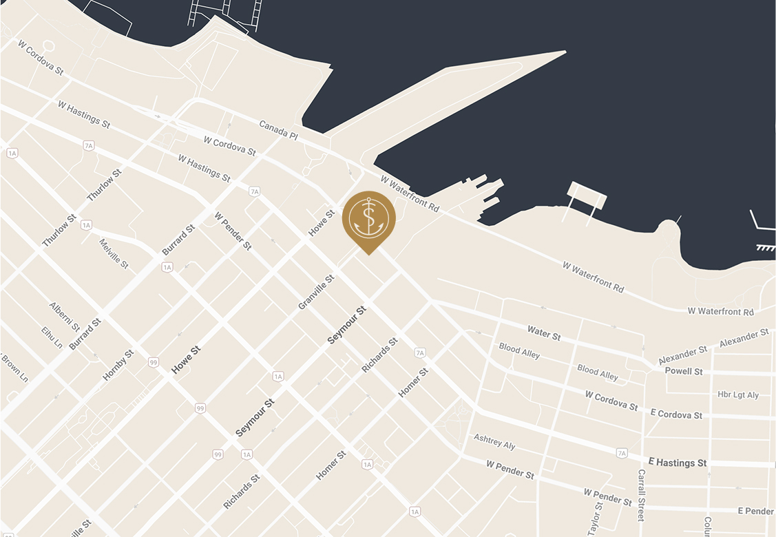 A map showing city streets near a waterfront, with a gold location marker featuring a dollar sign placed on West Waterfront Road near the water.